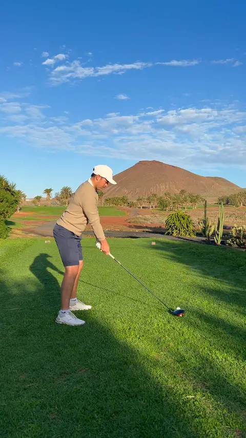 Golden-hour driver swing on the resort range
